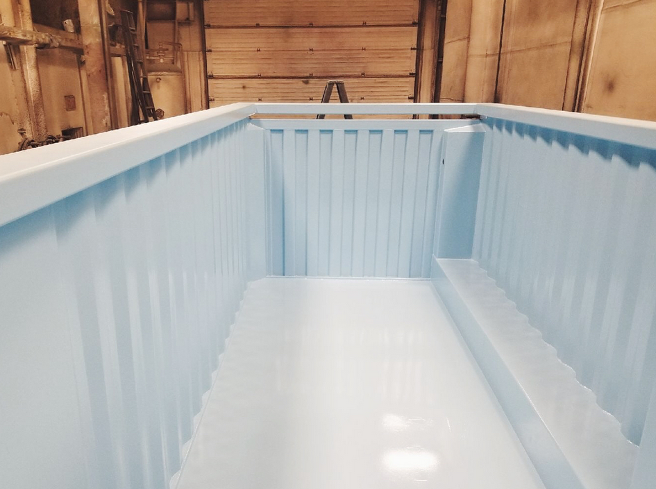 A modified sea-can turned into a pool, internally coated
                with a blue epoxy coating.